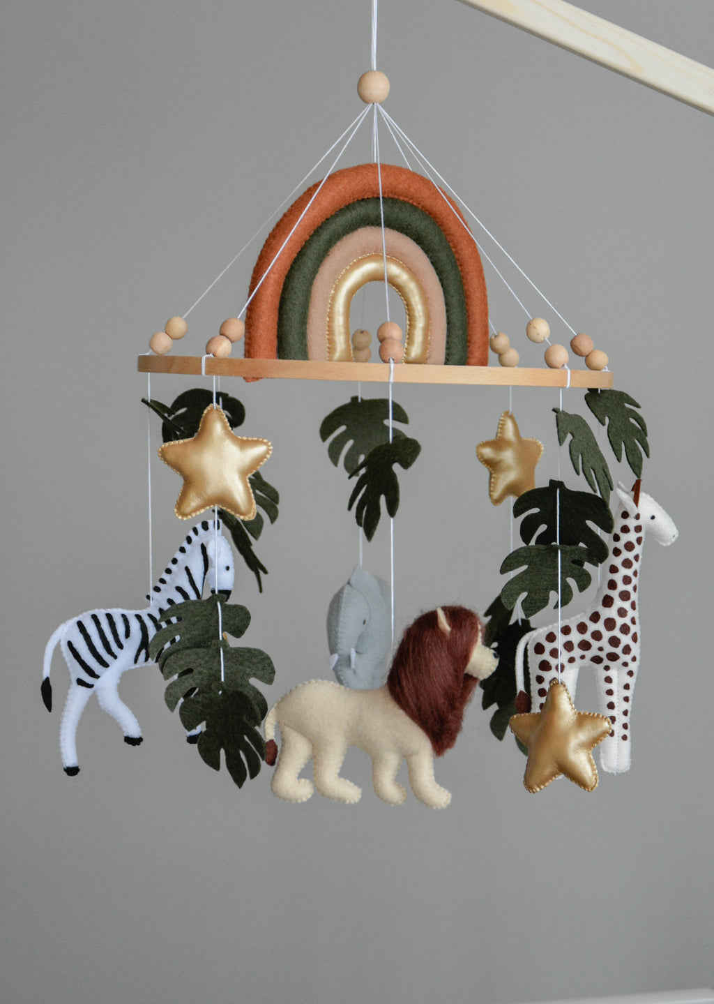 Safari Baby mobile with Lion, golden stars clouds, monstera leaves and rainbow