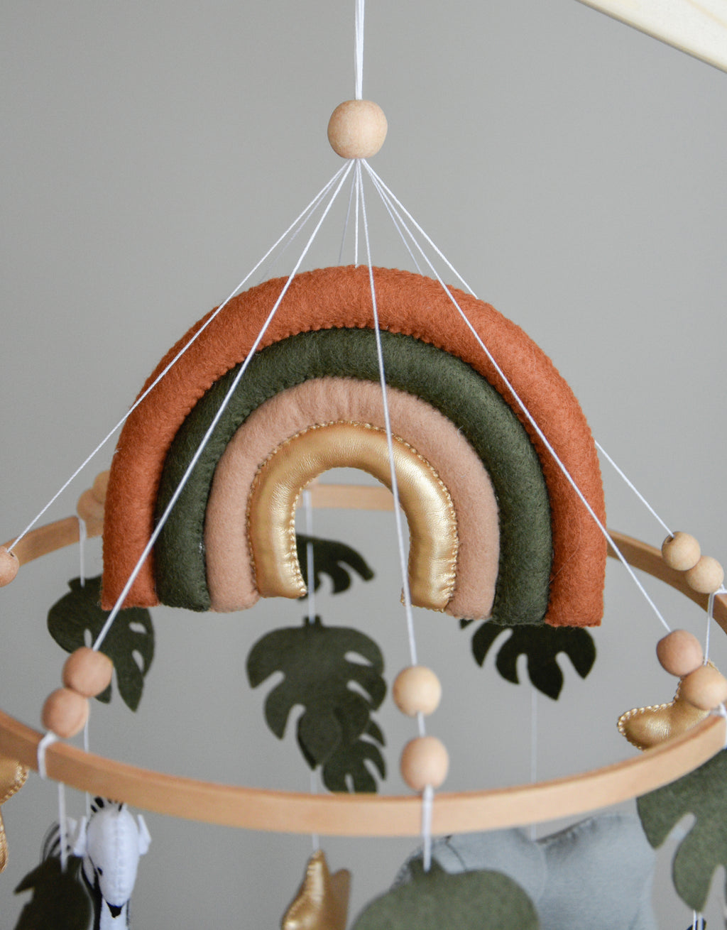 Safari Baby mobile with Lion, golden stars clouds, monstera leaves and rainbow