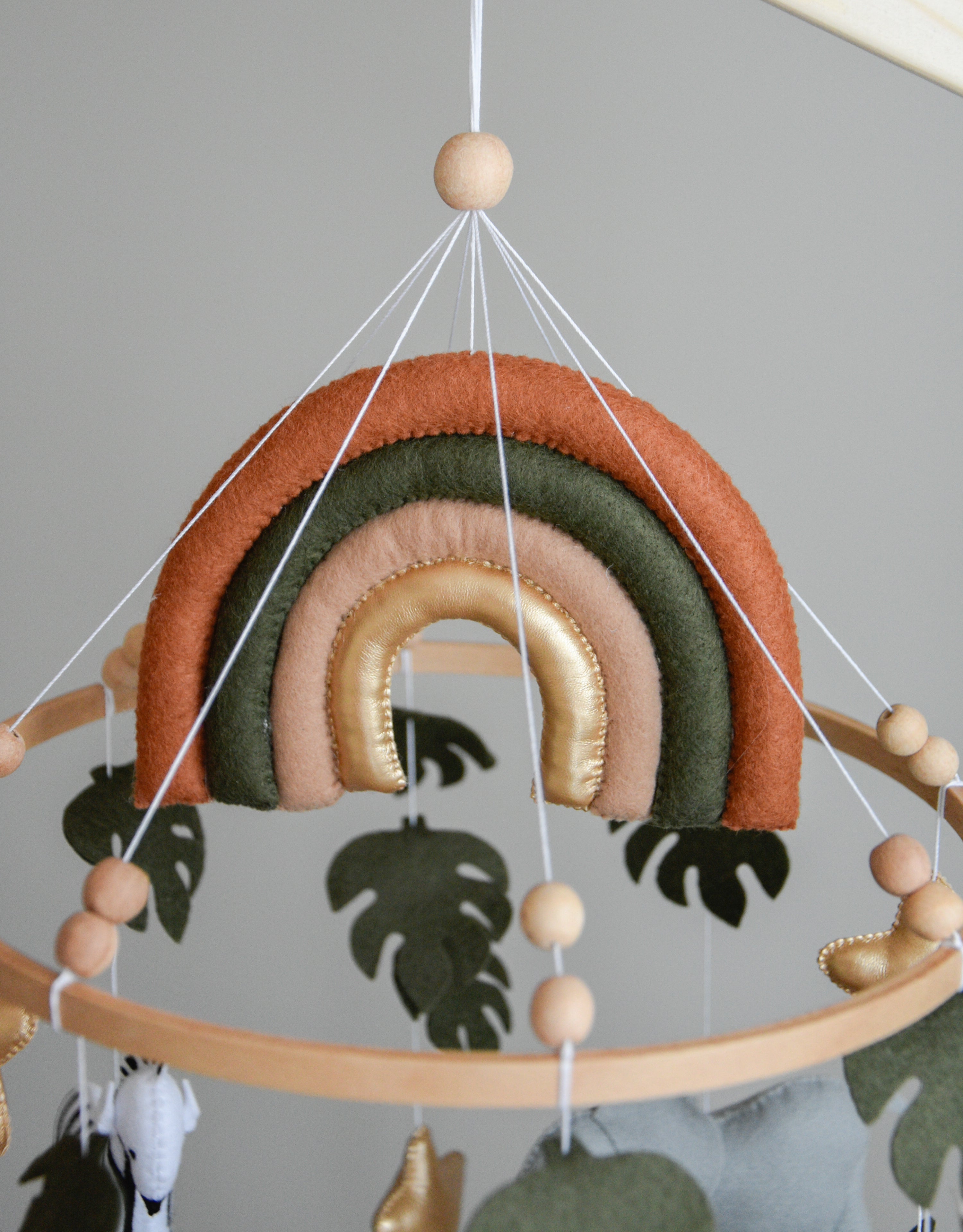 Safari Baby mobile with Lion, golden stars clouds, monstera leaves and rainbow