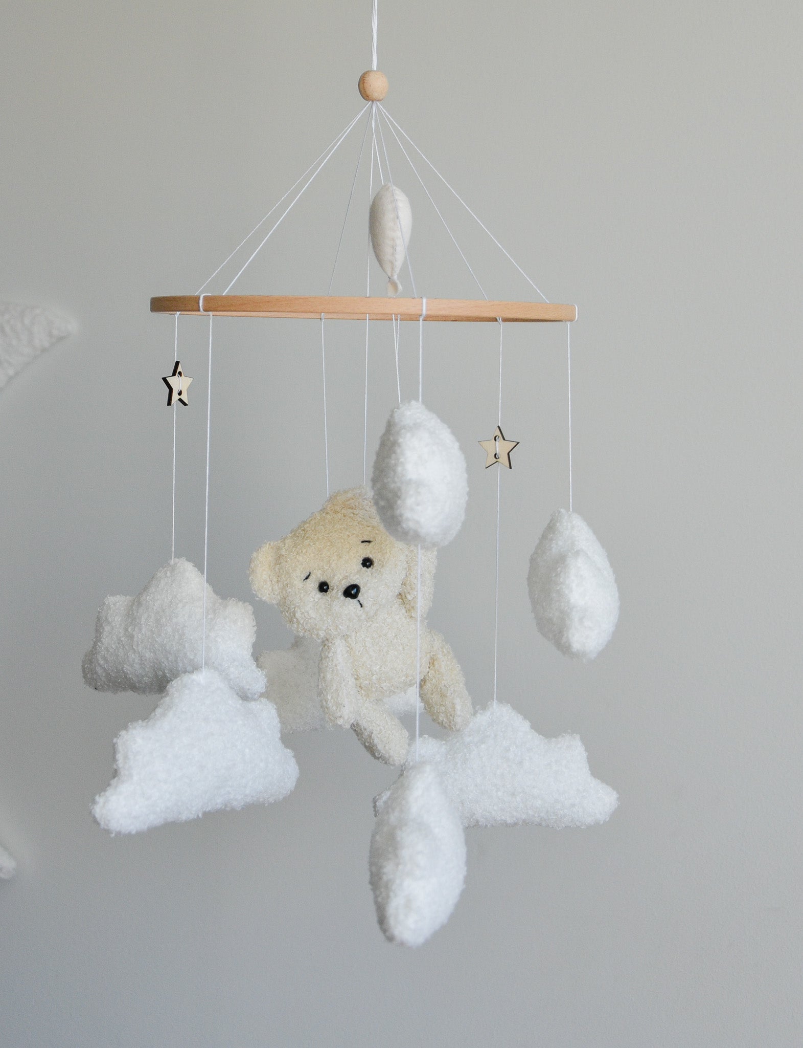 Teddy Bear hanging from balloon baby mobile with Boucle clouds
