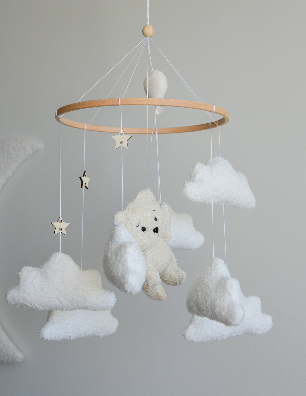 Teddy Bear hanging from balloon baby mobile with Boucle clouds