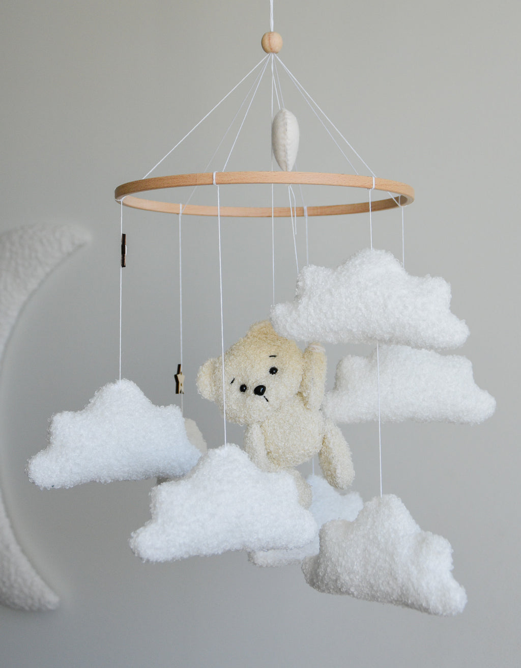 Teddy Bear hanging from balloon baby mobile with Boucle clouds