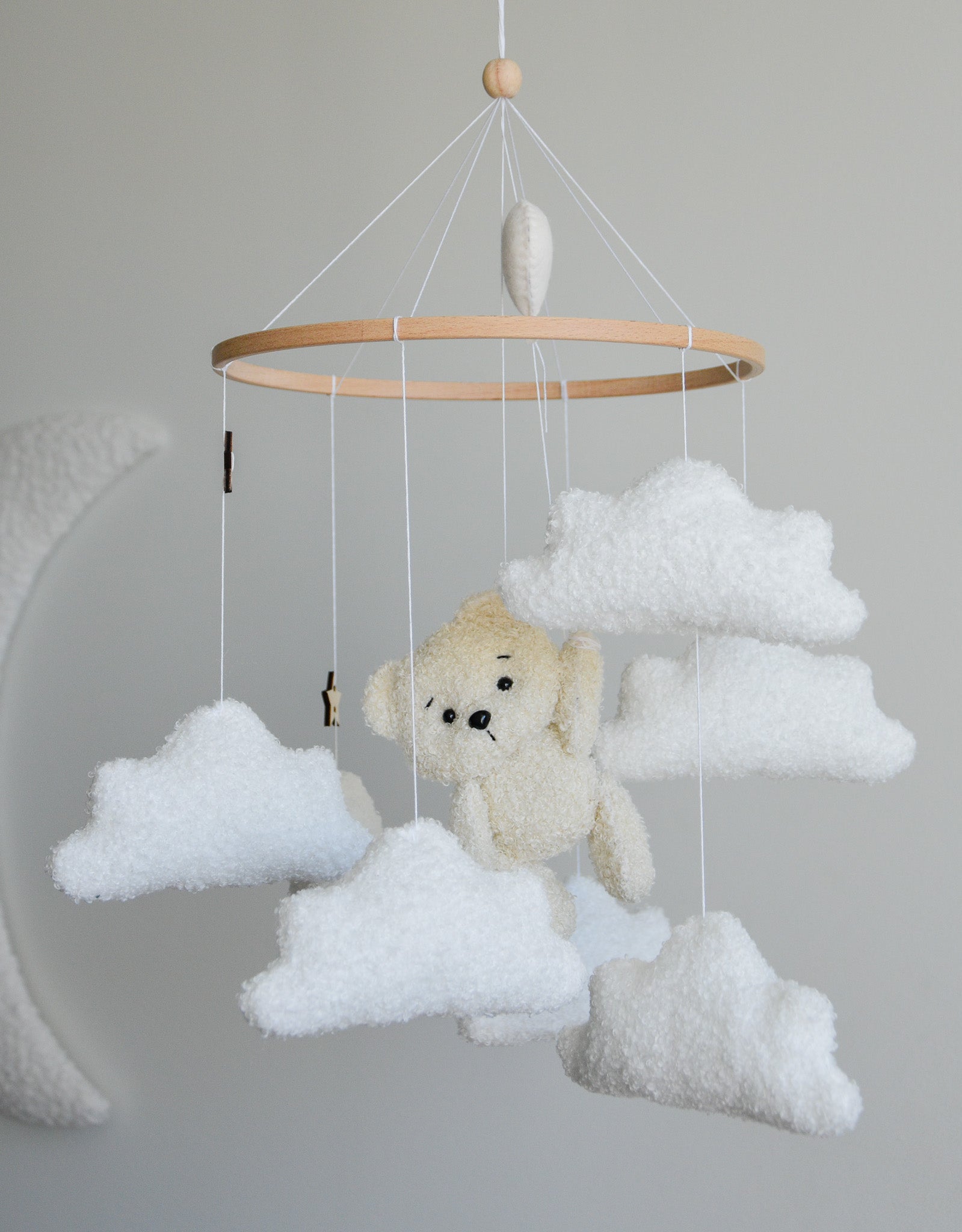 Teddy Bear hanging from balloon baby mobile with Boucle clouds