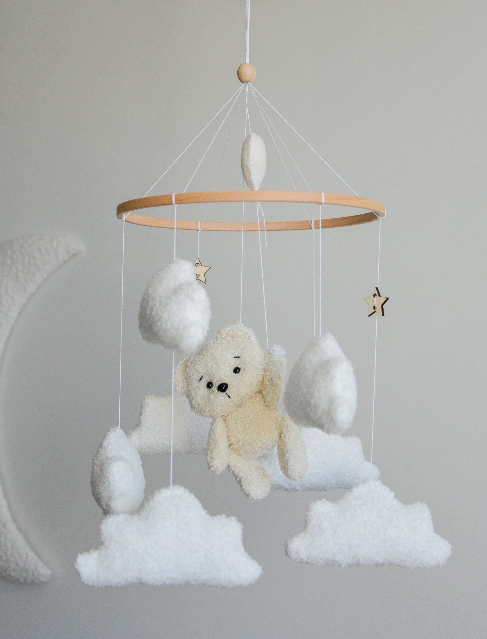 Teddy Bear hanging from balloon baby mobile with Boucle clouds
