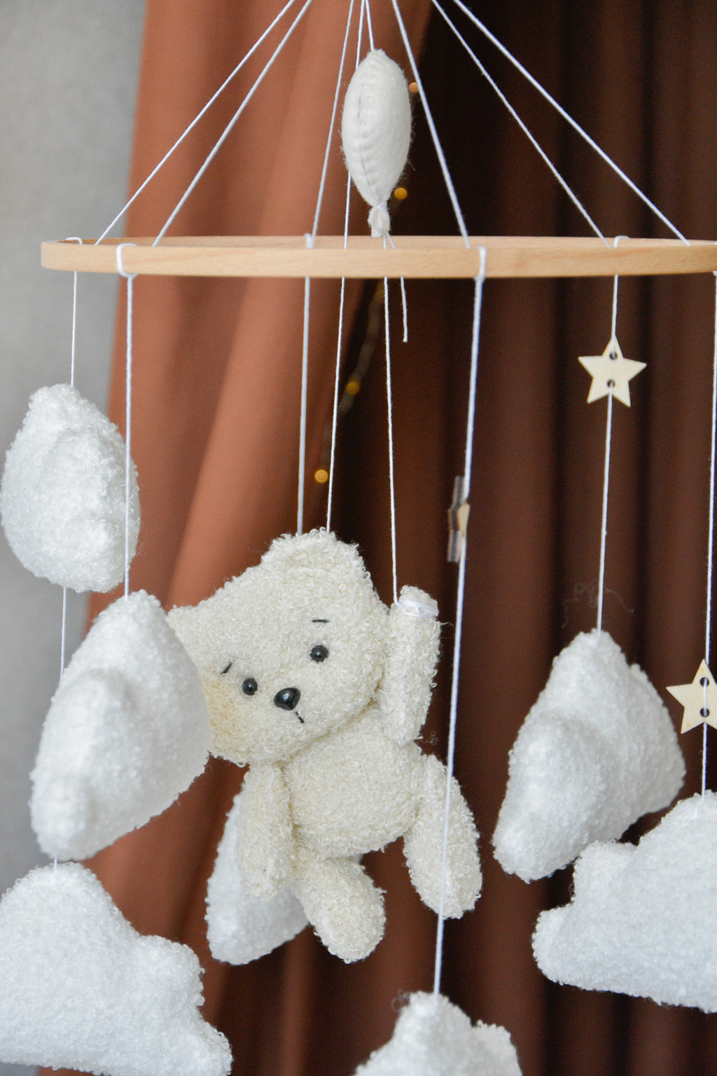 Teddy Bear hanging from balloon baby mobile with Boucle clouds