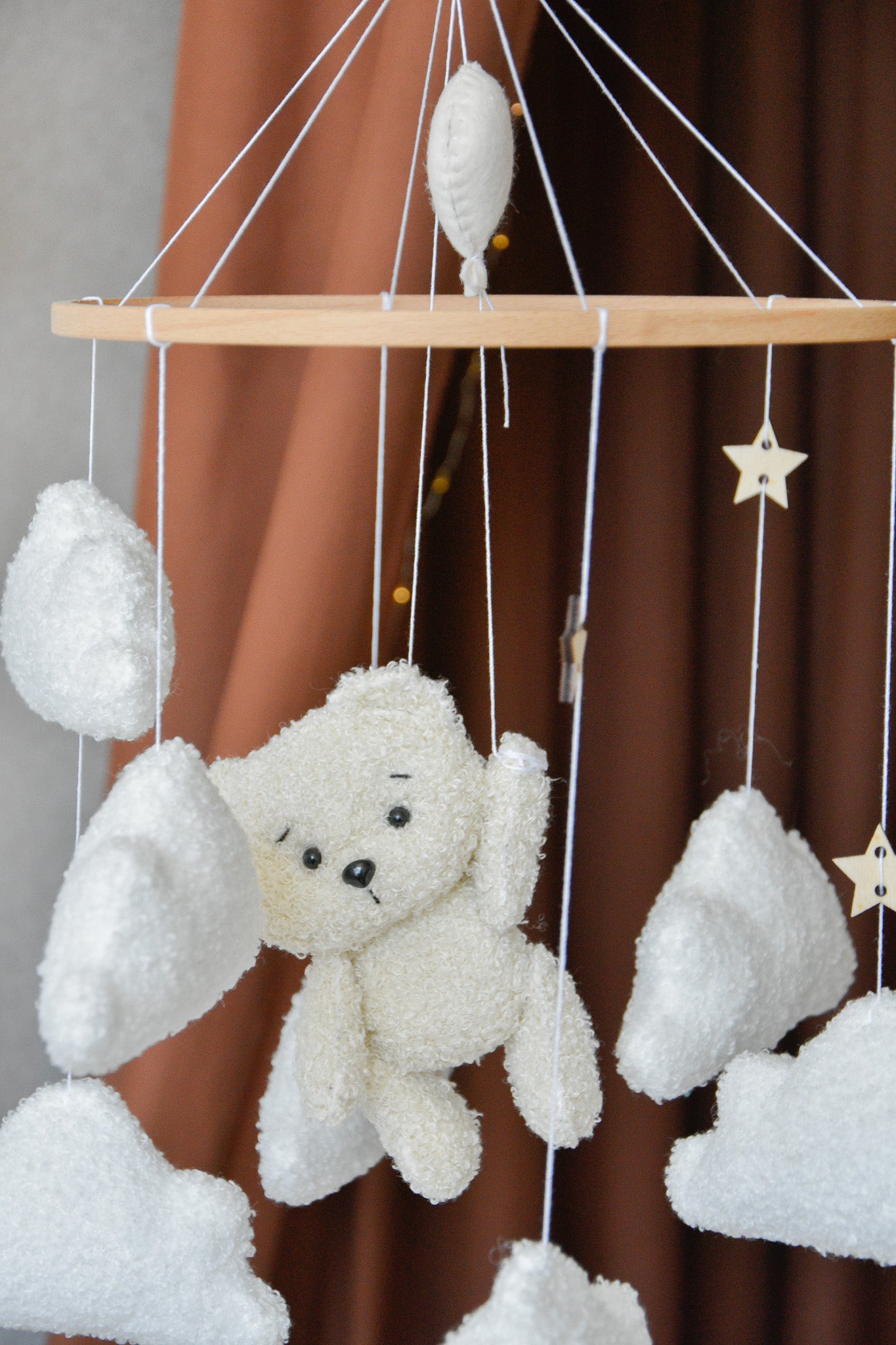 Teddy Bear hanging from balloon baby mobile with Boucle clouds