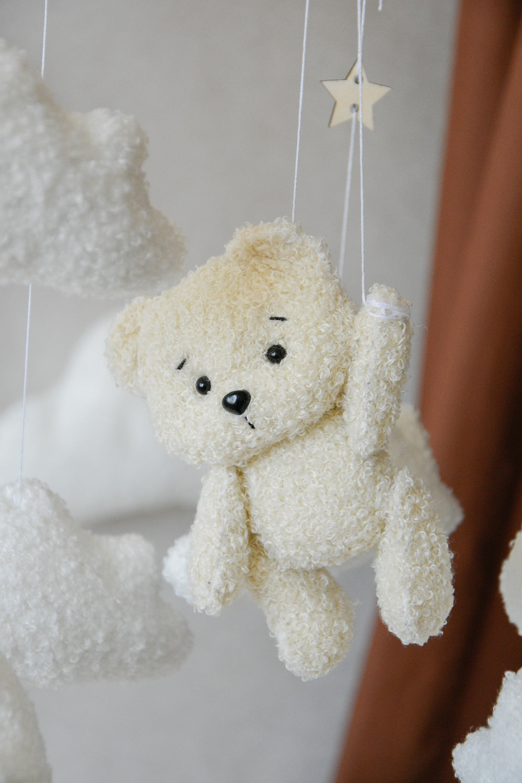 Teddy Bear hanging from balloon baby mobile with Boucle clouds