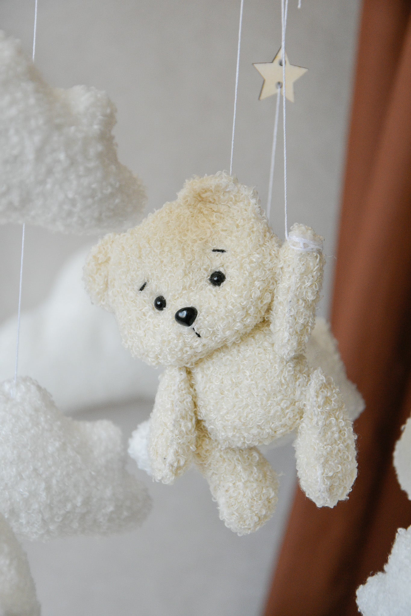 Teddy Bear hanging from balloon baby mobile with Boucle clouds