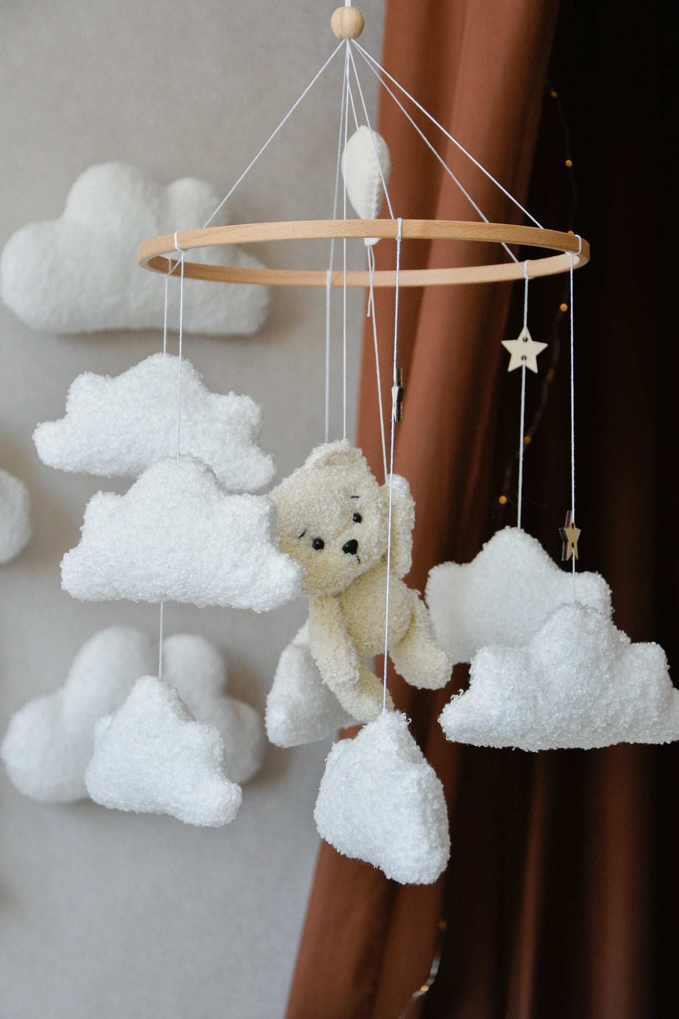 Teddy Bear hanging from balloon baby mobile with Boucle clouds