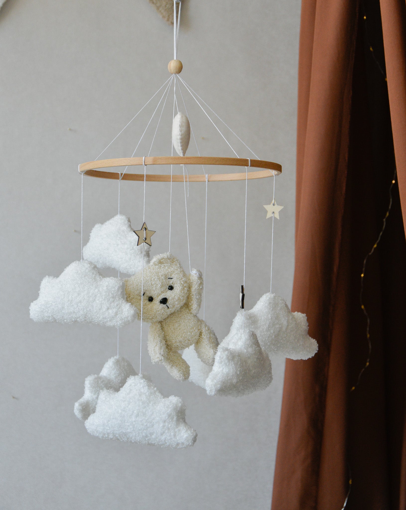 Teddy Bear hanging from balloon baby mobile with Boucle clouds