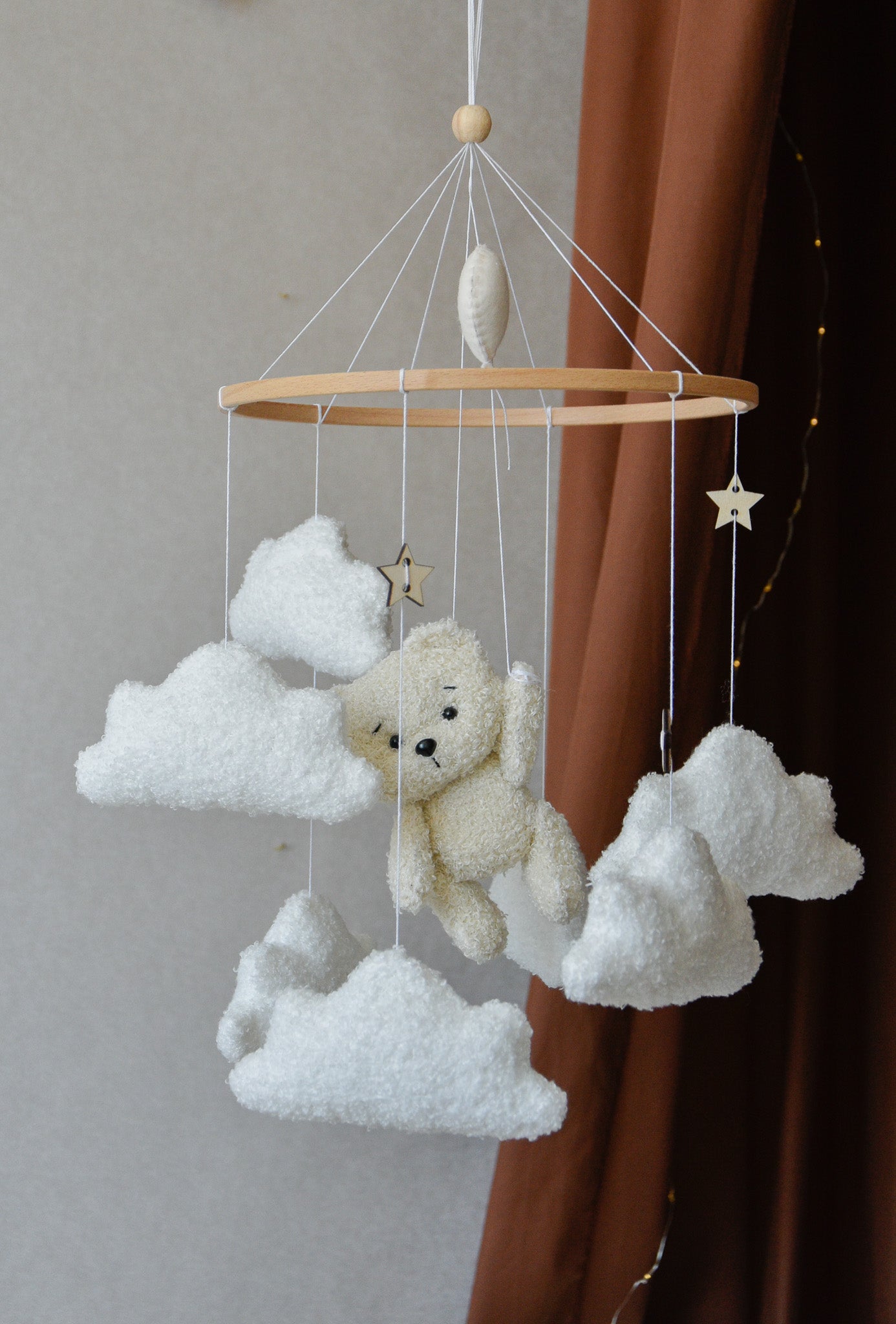 Teddy Bear hanging from balloon baby mobile with Boucle clouds