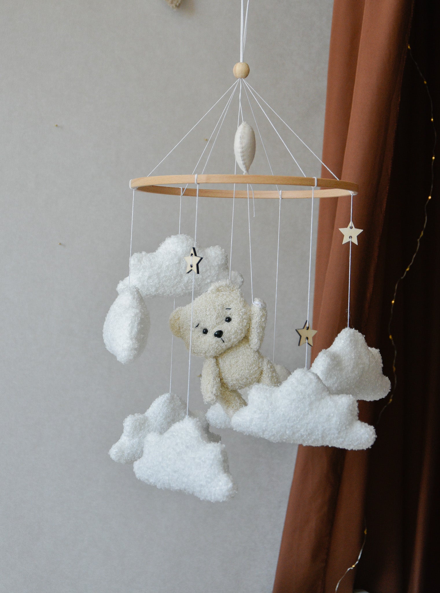 Teddy Bear hanging from balloon baby mobile with Boucle clouds