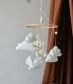 Teddy Bear hanging from balloon baby mobile with Boucle clouds