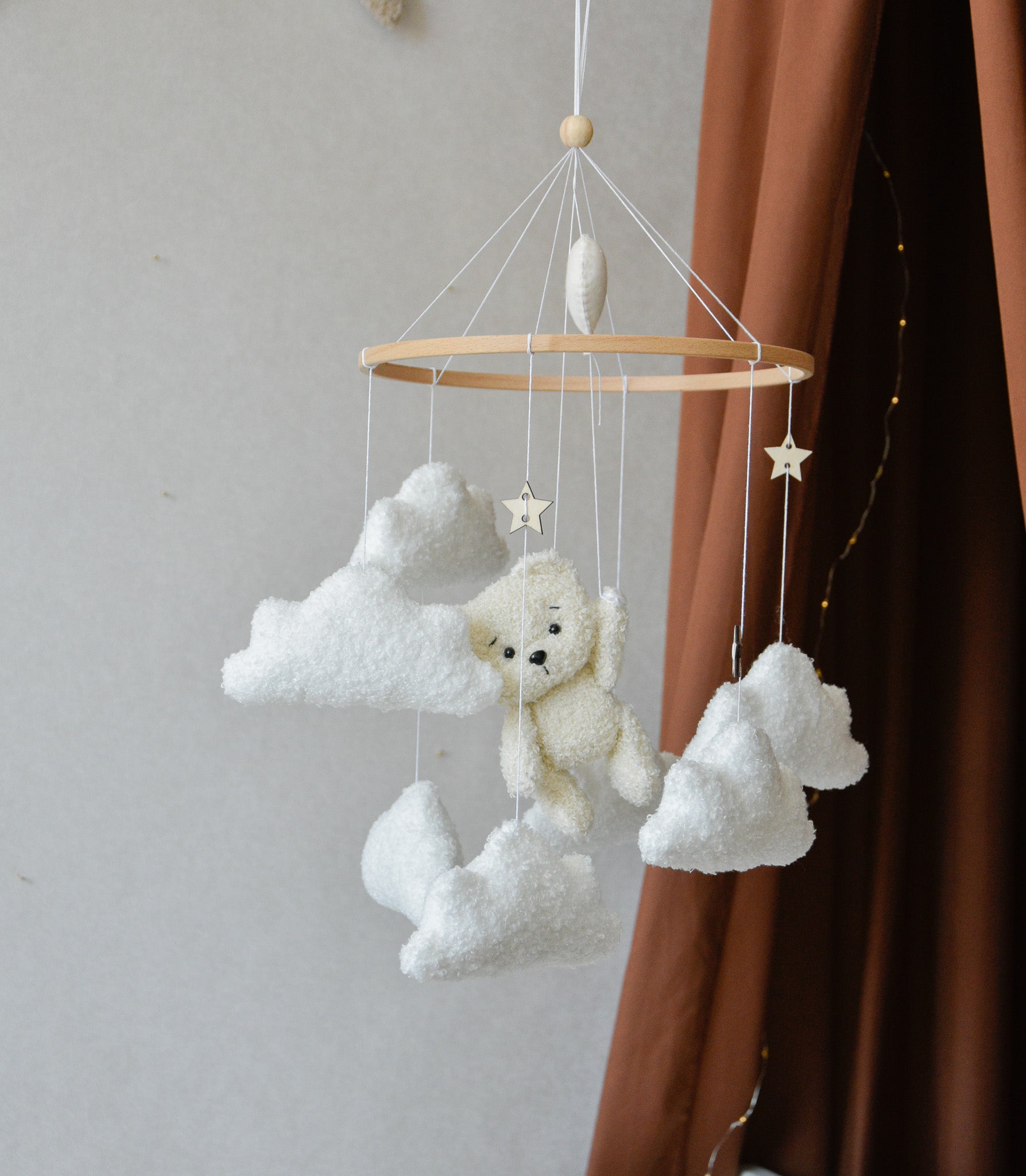 Teddy Bear hanging from balloon baby mobile with Boucle clouds
