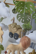 Safari mobile with offroad car, lion, zebra,, flamingos, elephants, monstera leaves, stars and clouds