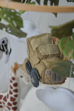 Safari mobile with offroad car, lion, zebra,, flamingos, elephants, monstera leaves, stars and clouds