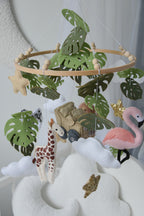 Safari mobile with offroad car, lion, zebra,, flamingos, elephants, monstera leaves, stars and clouds