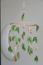 Forest style floral mobile with leaves and wooden pearls - Minidreams Decor