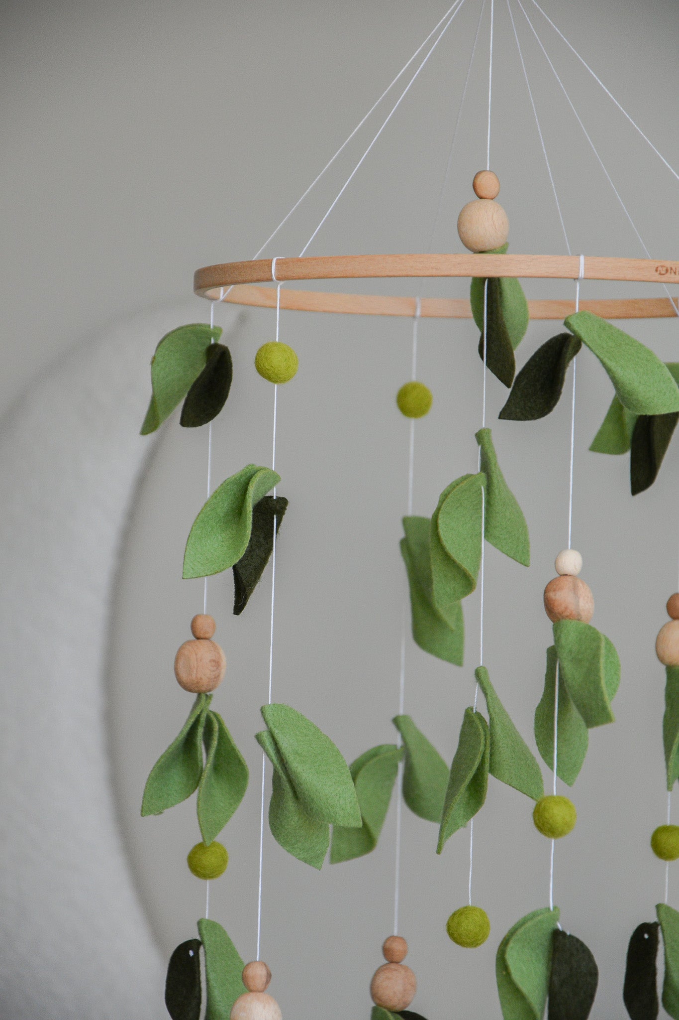 Forest style floral mobile with leaves and wooden pearls