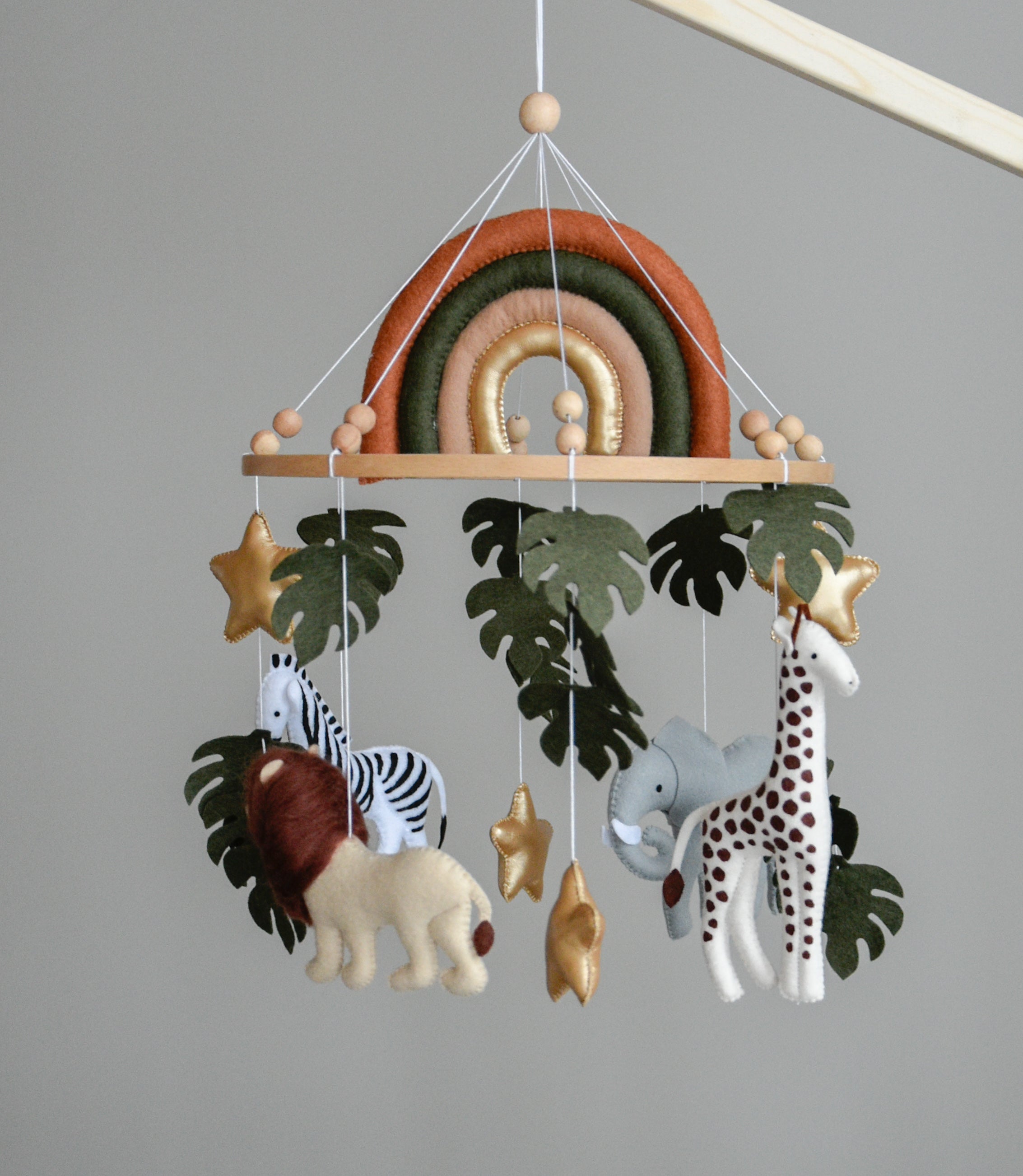 Safari Baby mobile with Lion, golden stars clouds, monstera leaves and rainbow