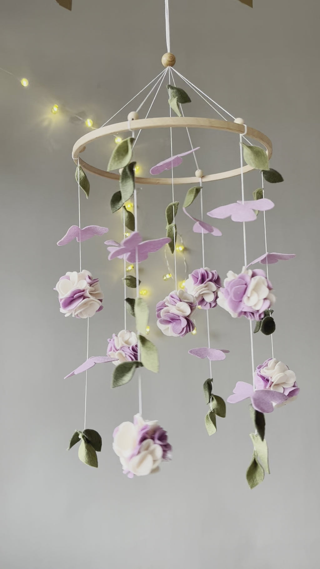Floral mobile with purple white flower, butterfly and leaves