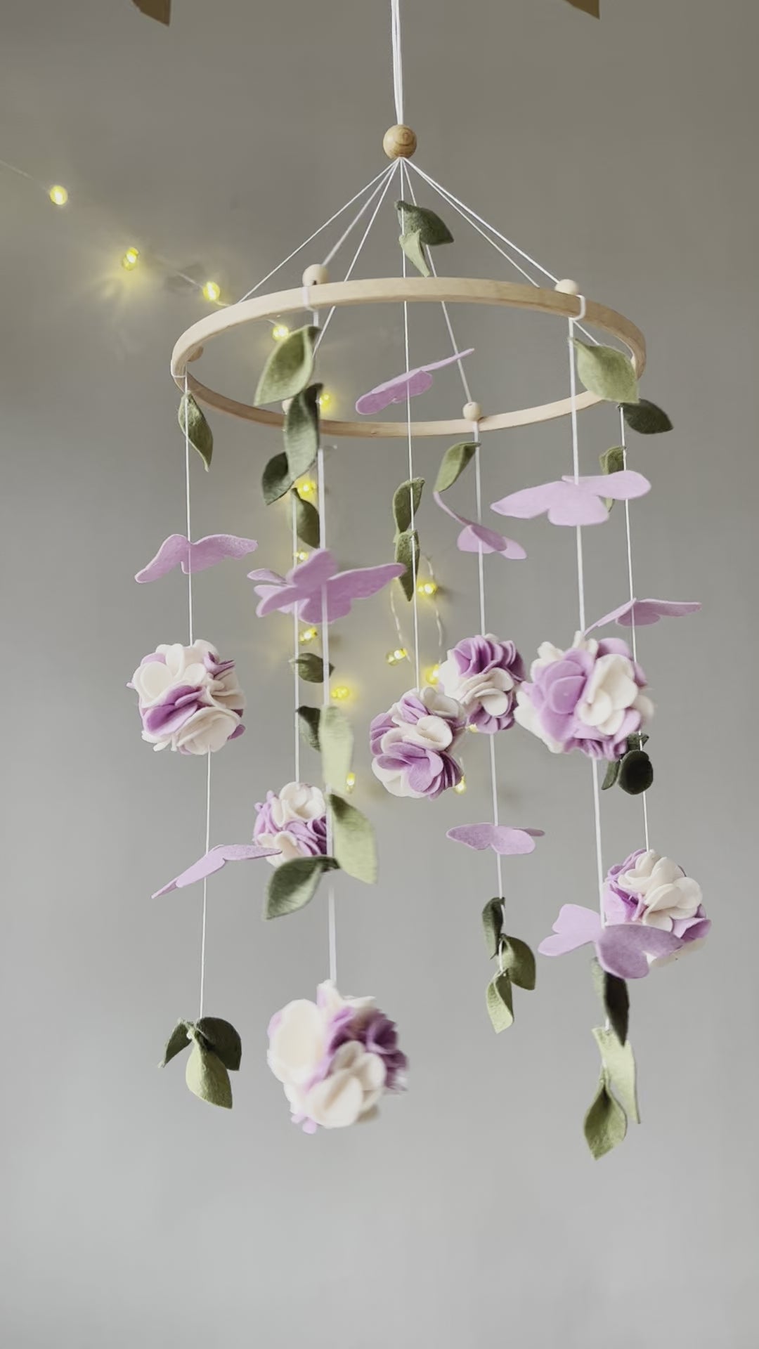 Floral mobile with purple white flower, butterfly and leaves