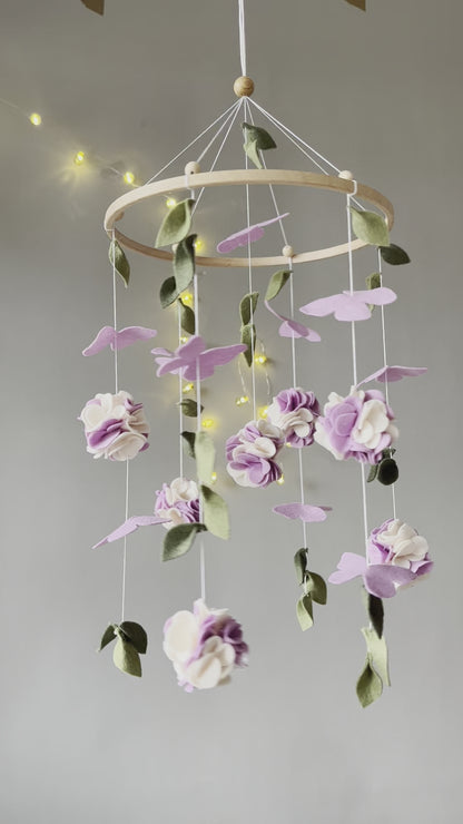 Floral mobile with purple white flower, butterfly and leaves