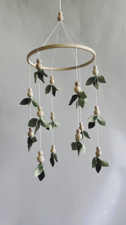 Forest style floral mobile with leaves and wooden pearls