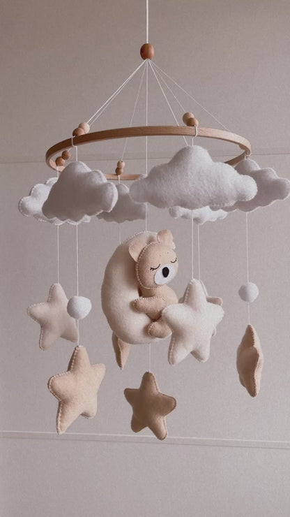 Sleeping bear mobile with beige and soft white stars, clouds and moon