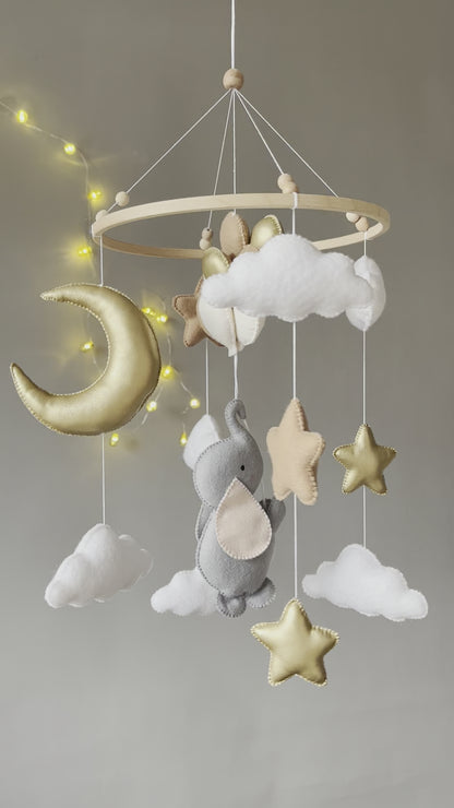 Baby mobile with elephant, moon, clouds and stars