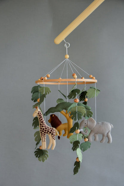 Safari mobile with felt, giraffe, lion, zebra, elephant, monstera leaves, tree and wooden pearls