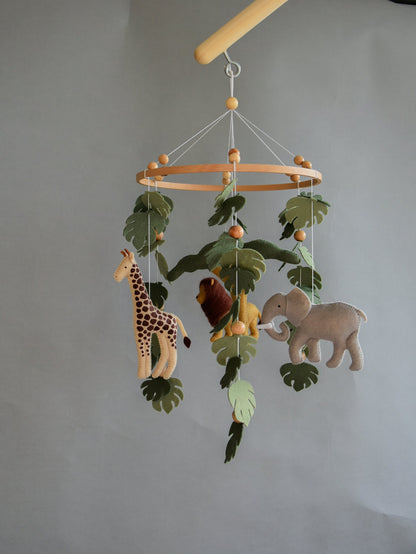 Safari mobile with felt, giraffe, lion, zebra, elephant, monstera leaves, tree and wooden pearls