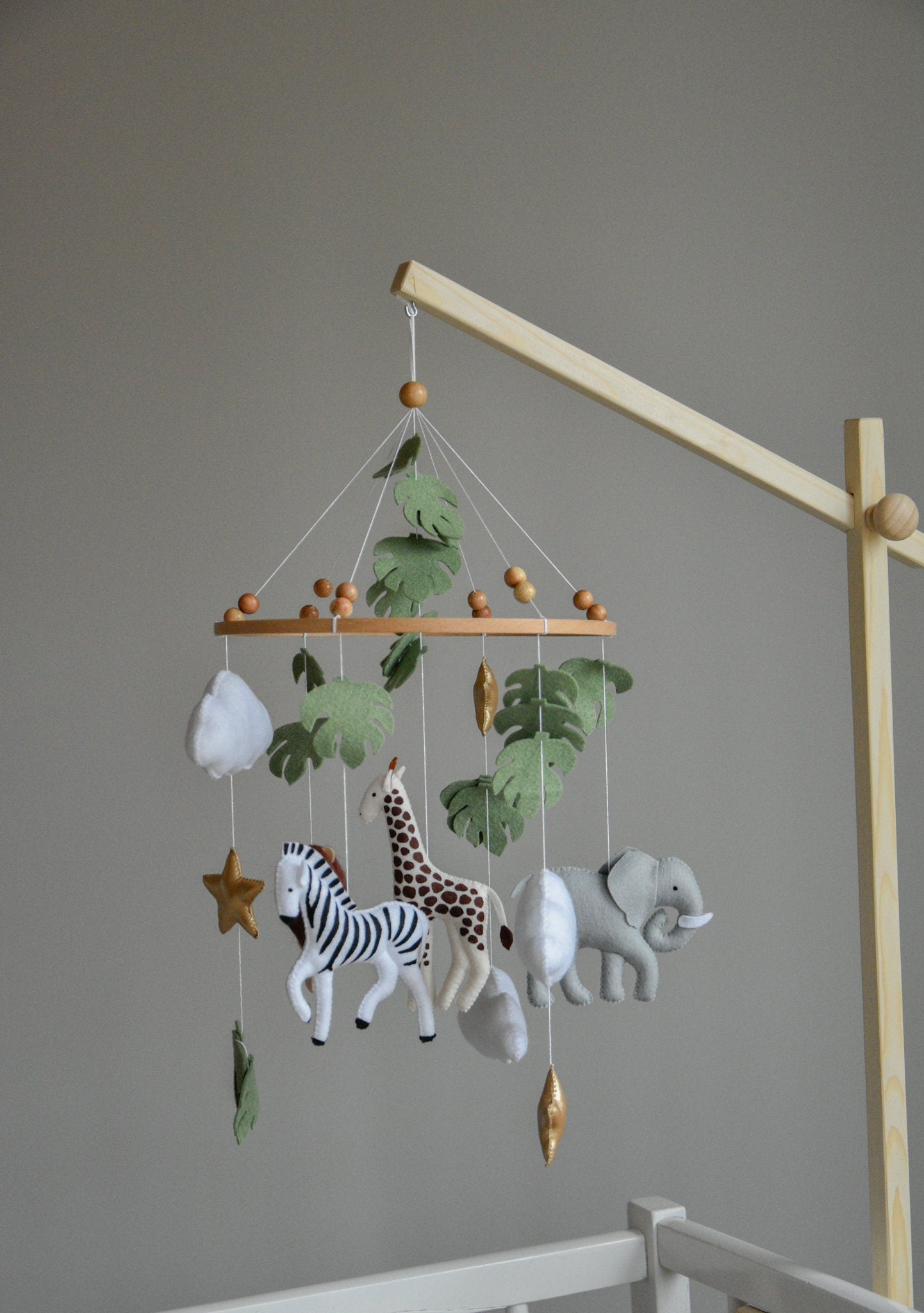 Safari mobile with felt, giraffe, lion, zebra, elephant, star and clouds