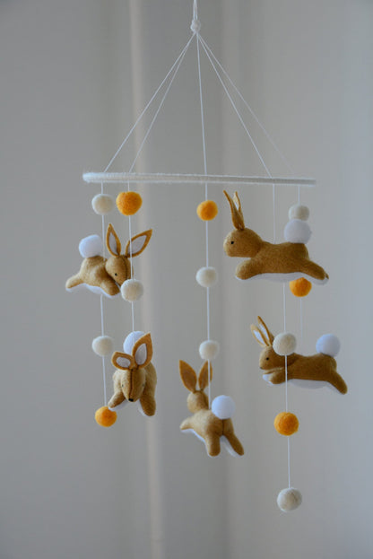 Jumping bunny mobile with felted balls