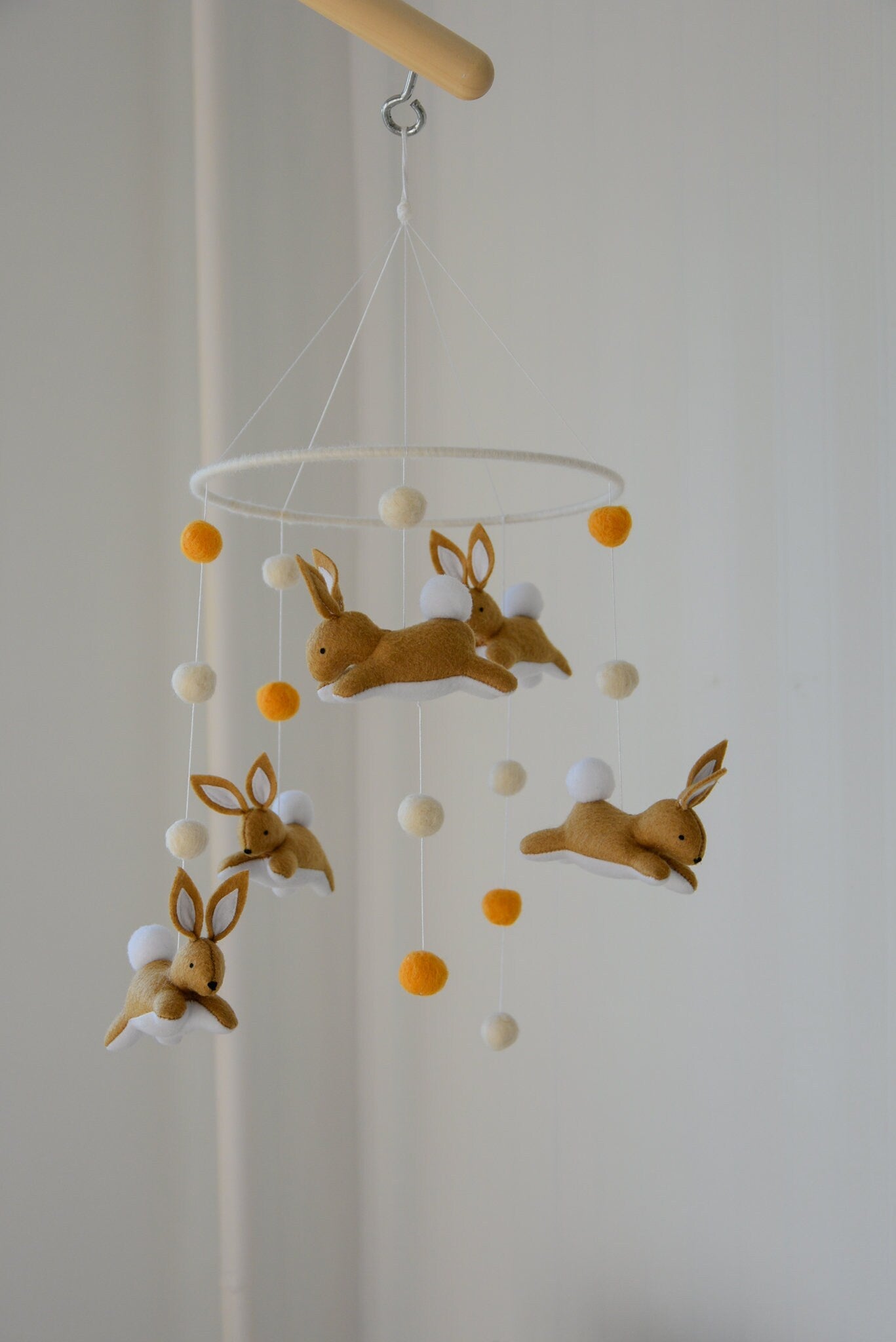 Jumping bunny mobile with felted balls