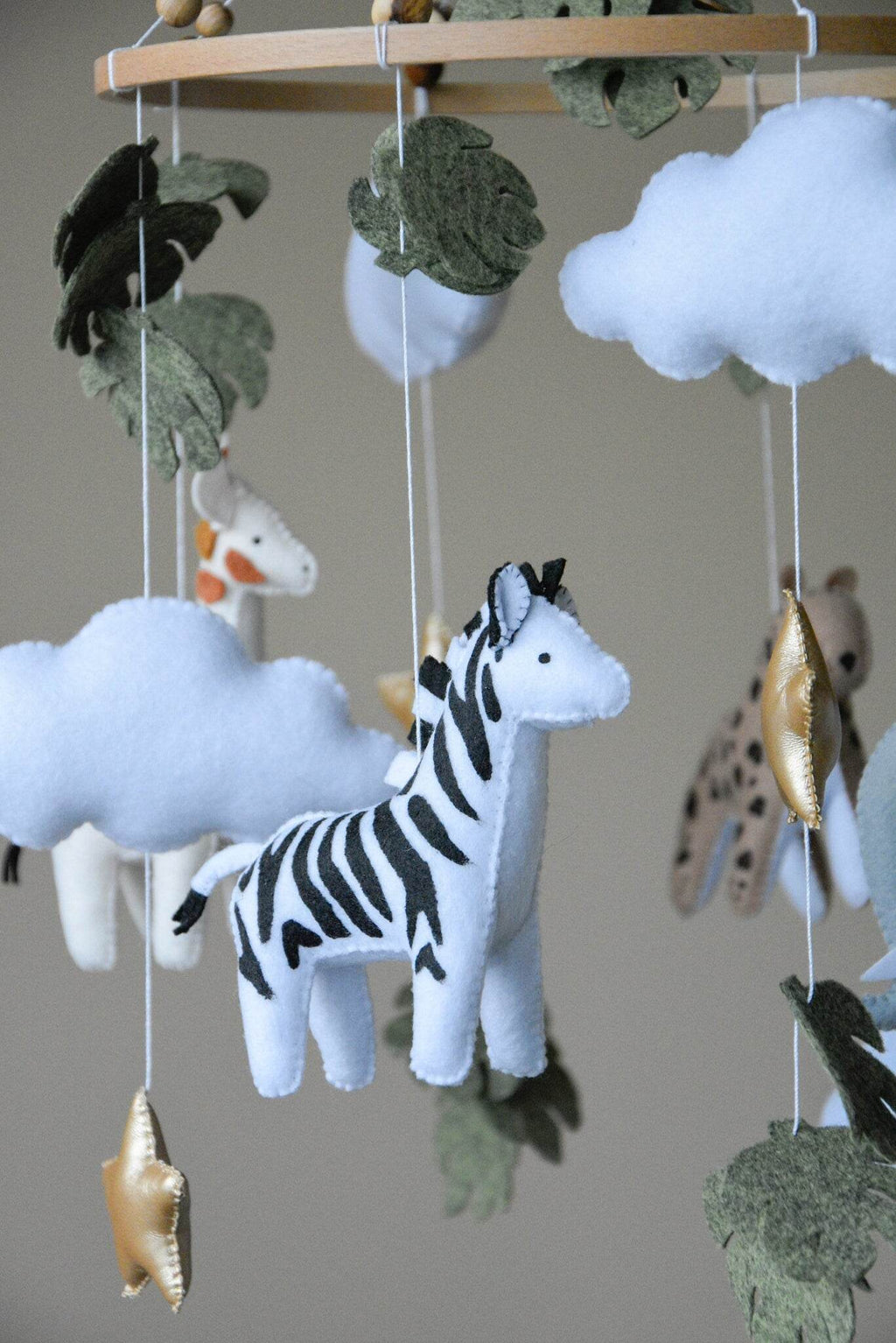 Safari mobile with cute African animals,giraffe, elephant, lion, zebra and monstera leaves - Minidreams Decor