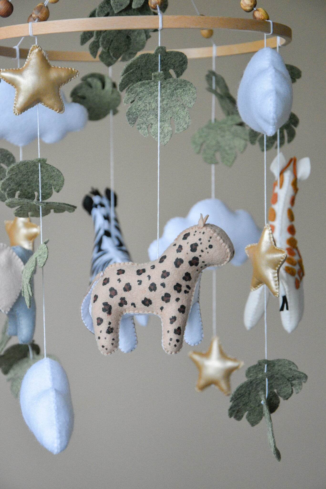 Safari mobile with cute African animals,giraffe, elephant, lion, zebra and monstera leaves - Minidreams Decor