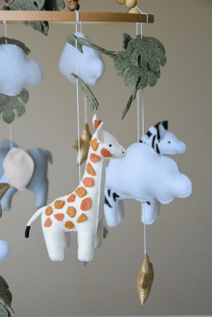 Safari mobile with cute African animals,giraffe, elephant, lion, zebra and monstera leaves