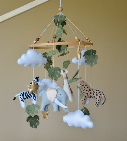 Safari mobile with cute African animals,giraffe, elephant, lion, zebra and monstera leaves