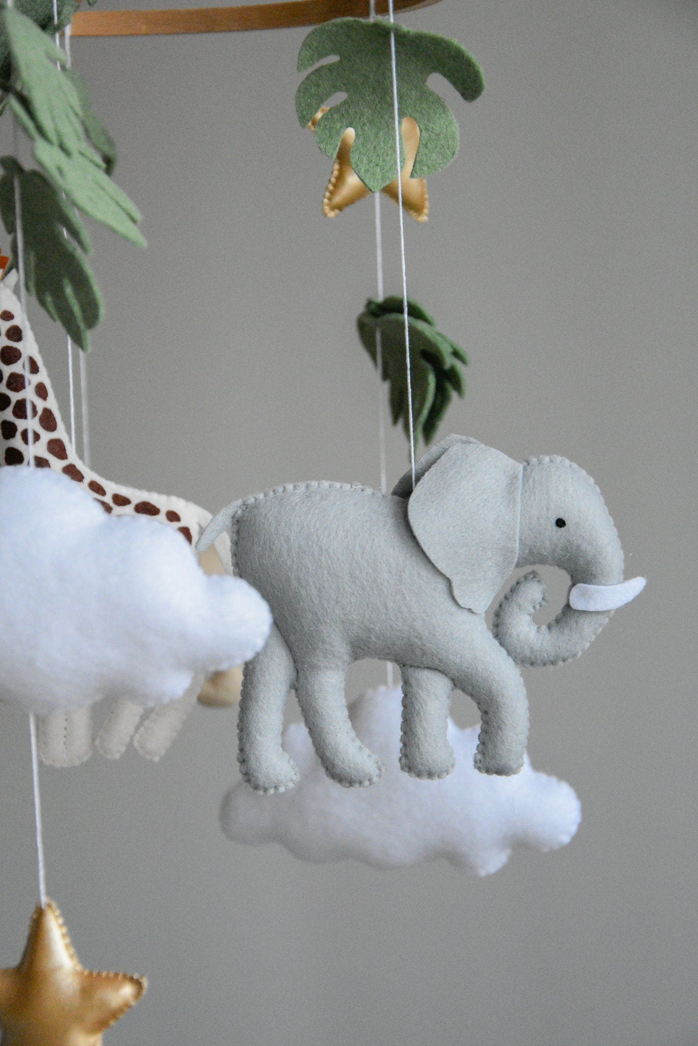 Safari mobile with felt, giraffe, lion, zebra, elephant, star and clouds