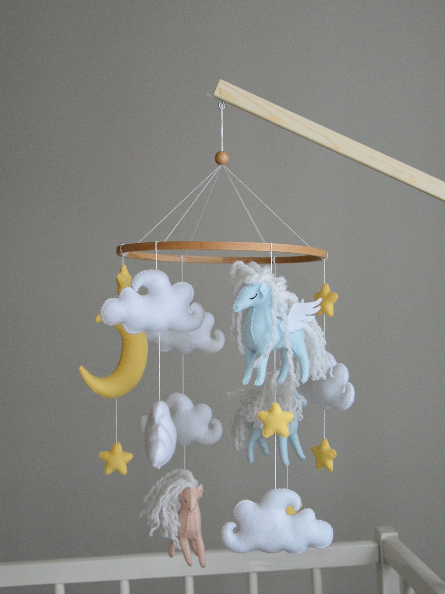 Horse mobile with clouds and pale yellow stars