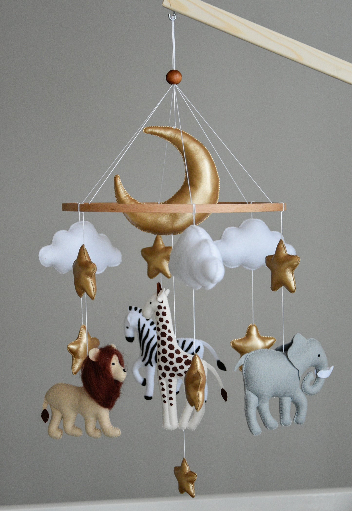 Safari mobile with giraffe, lion, elephant, moon, stars and clouds