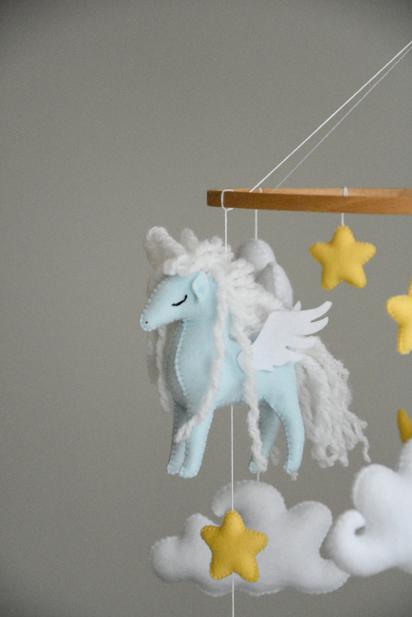 Horse mobile with clouds and pale yellow stars