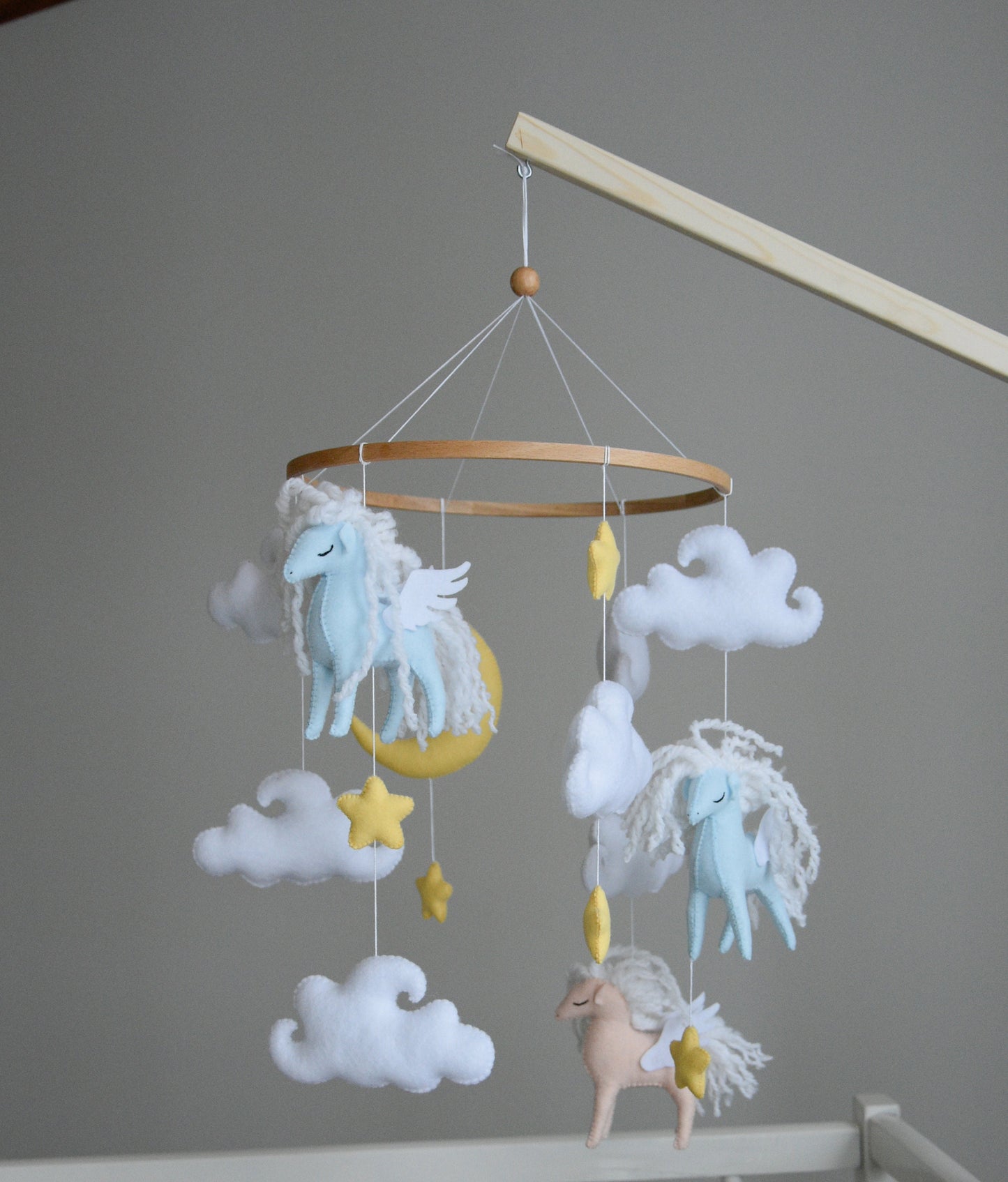 Horse mobile with clouds and pale yellow stars