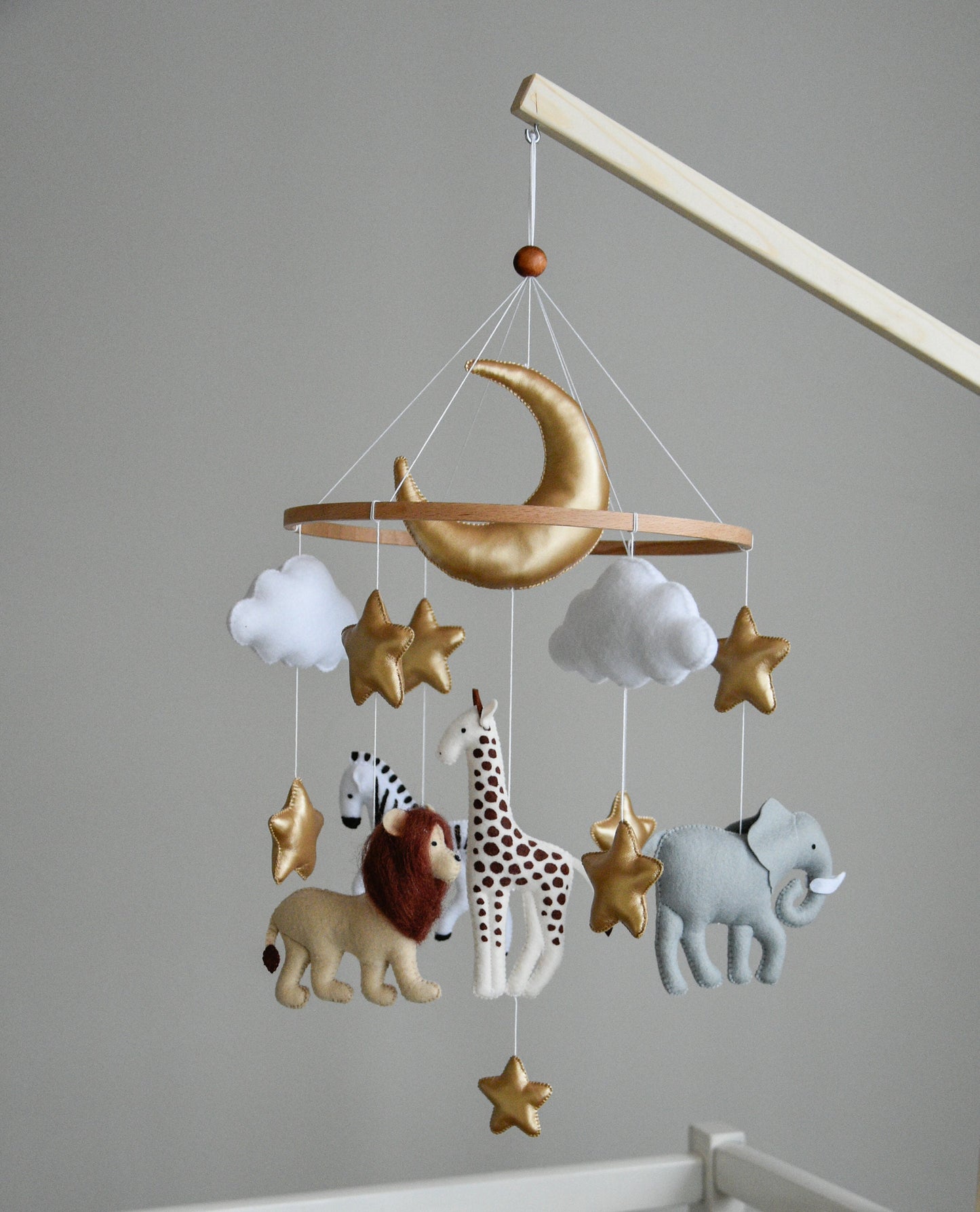 Safari mobile with giraffe, lion, elephant, moon, stars and clouds