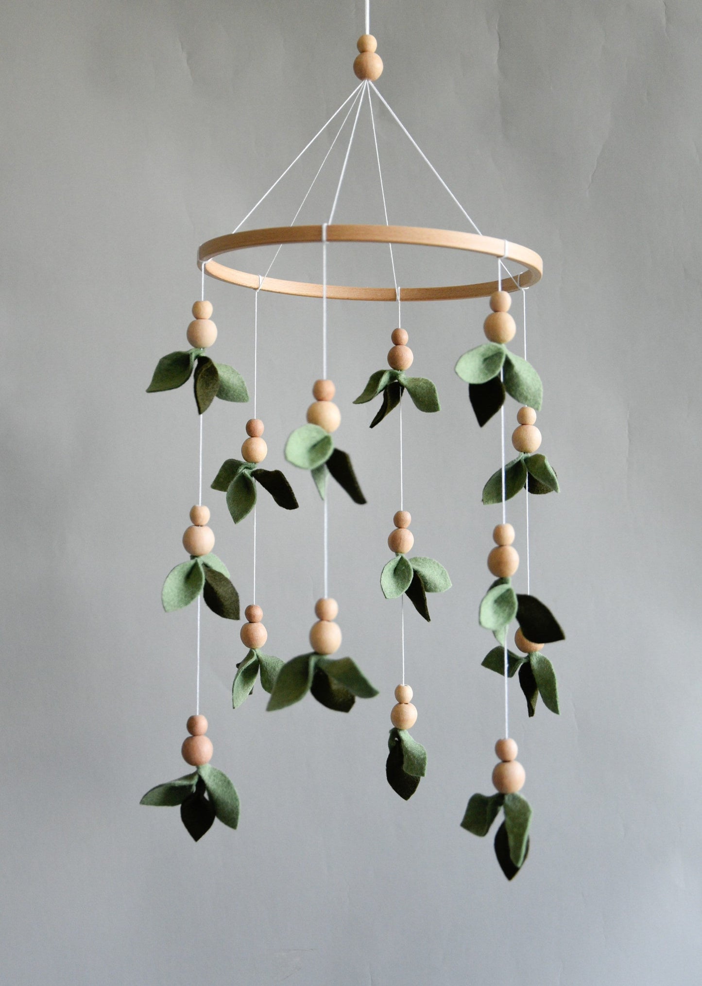 Forest style floral mobile with leaves and wooden pearls