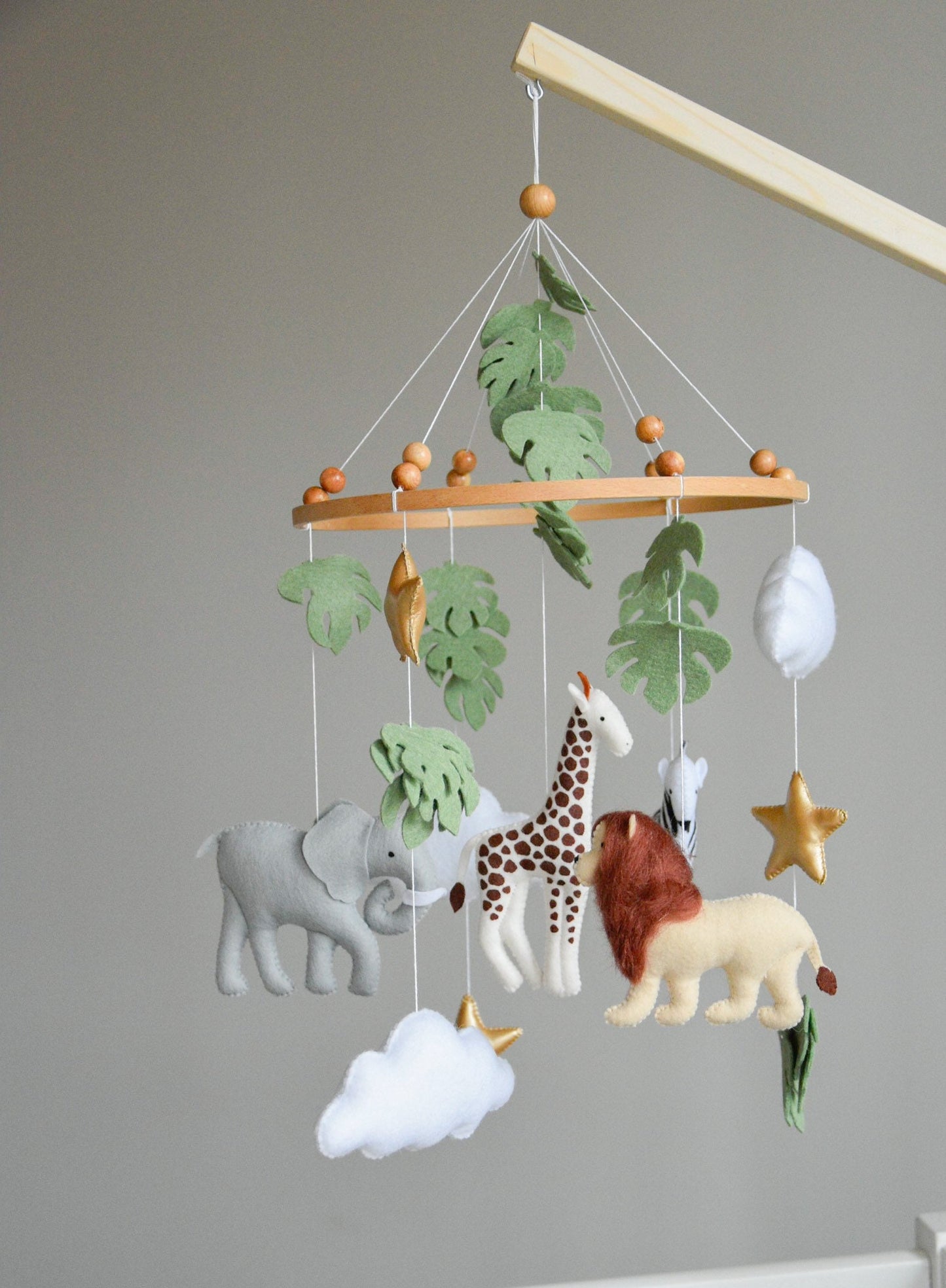 Safari mobile with felt, giraffe, lion, zebra, elephant, star and clouds