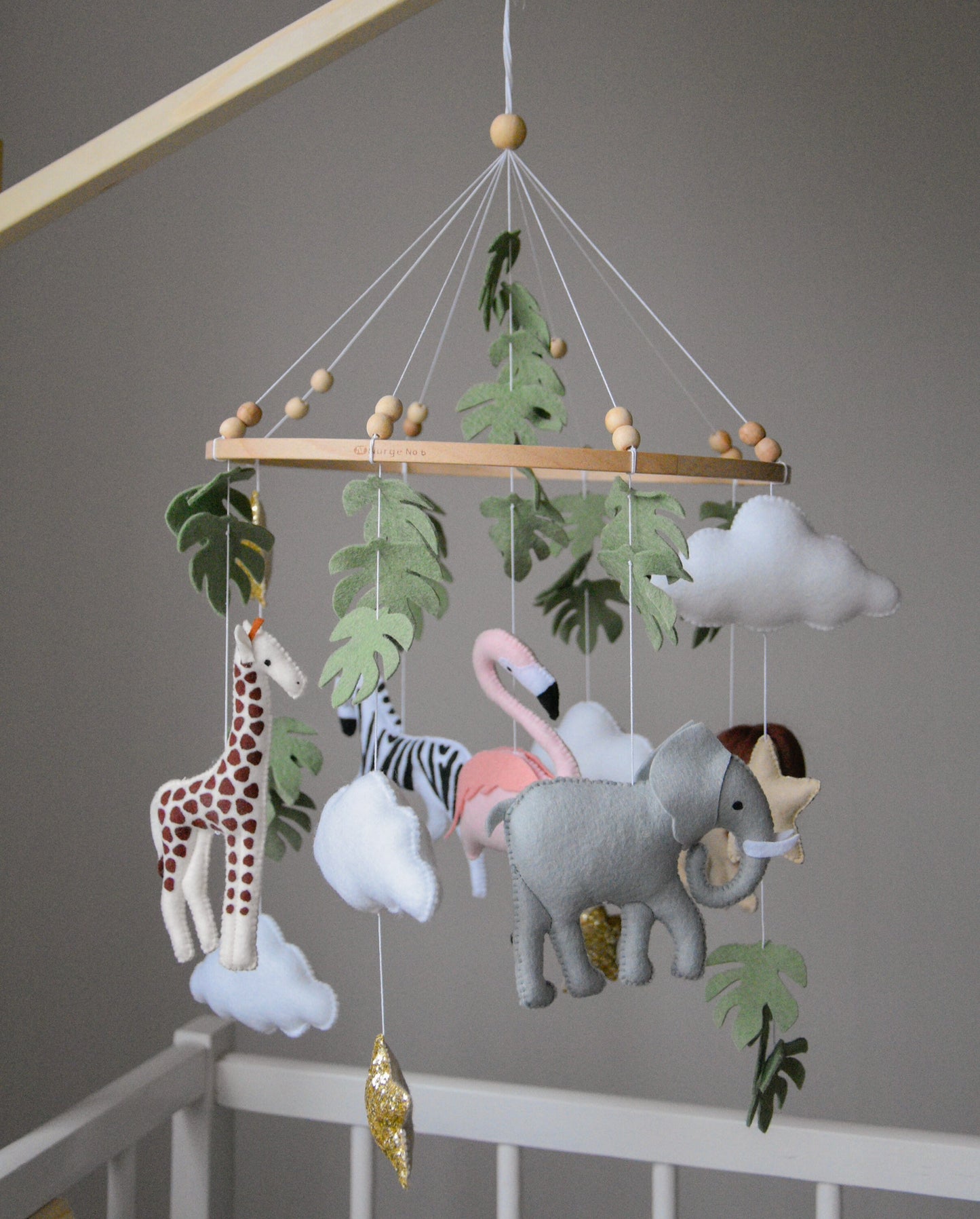 Safari  mobile with lion, zebra,, flamingos, elephants, monstera leaves, stars and clouds