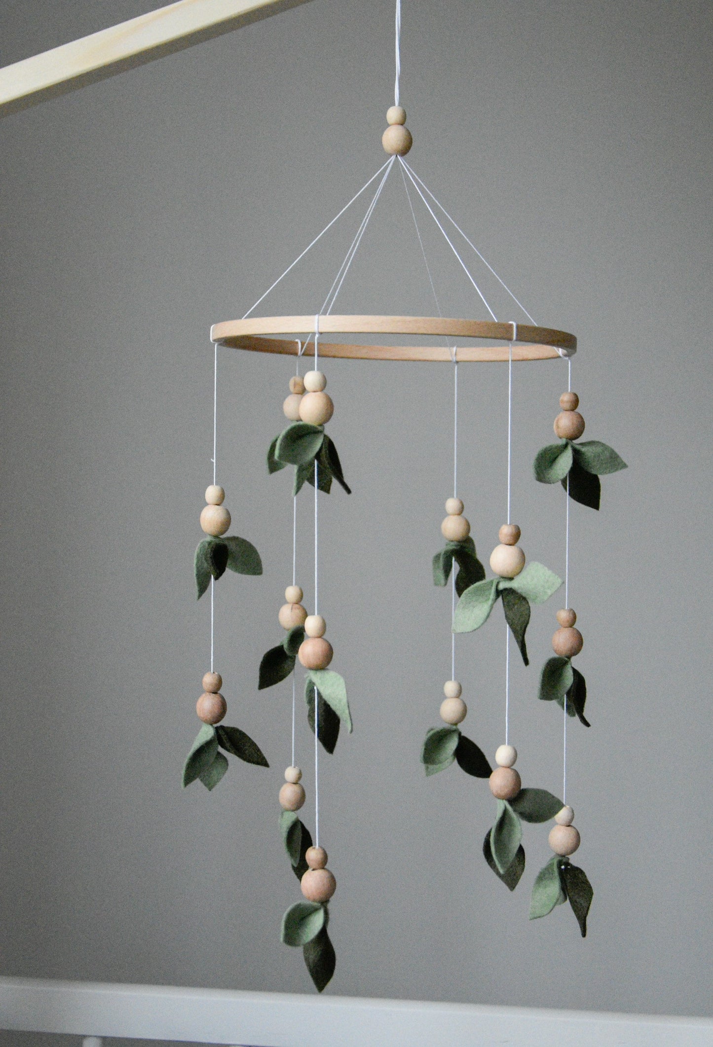 Forest style floral mobile with leaves and wooden pearls