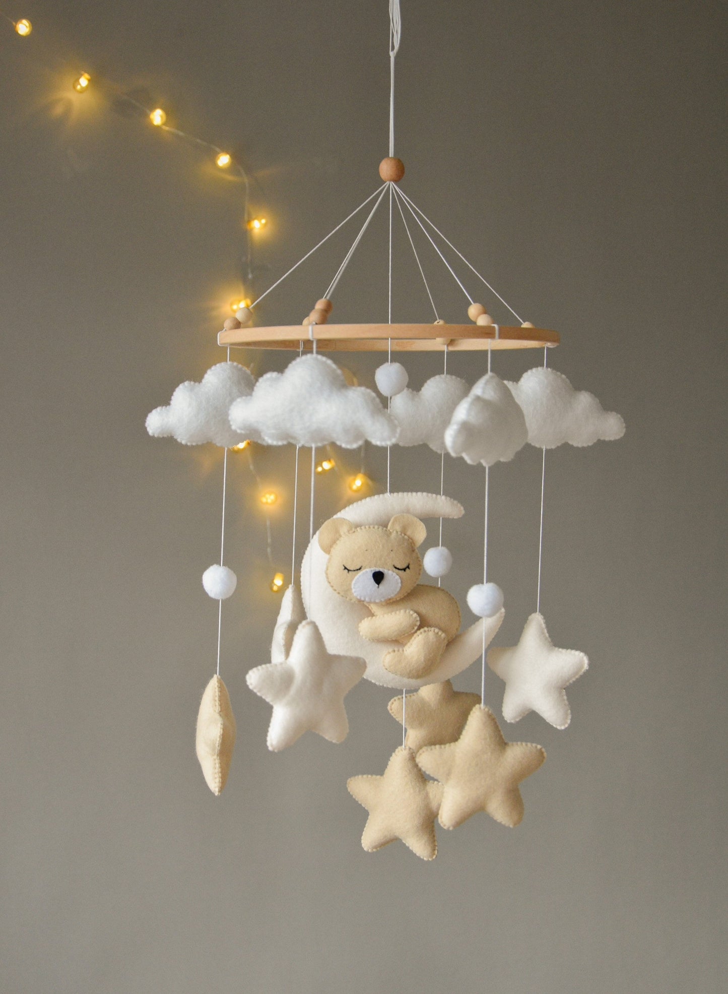 Sleeping bear mobile with beige and soft white stars, clouds and moon